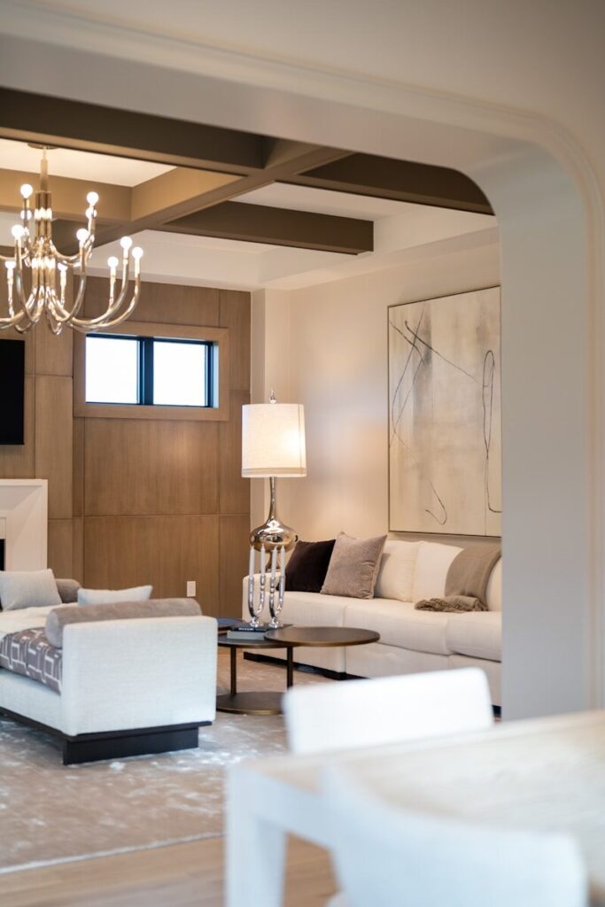 Modern living room with white sofa and abstract art.