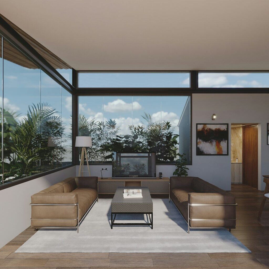 Modern living room with large windows and plants.